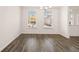 Bright dining room features hardwood floors and large windows at 593 Princeton Elm Place, Lawrenceville, GA 30045