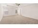 Large main bedroom with neutral carpeting and ceiling fan at 593 Princeton Elm Place, Lawrenceville, GA 30045