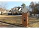 Brick mailbox in front of a beige house with a large yard at 610 Erins Way, Mcdonough, GA 30253