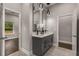 Double vanity bathroom with modern fixtures and lighting at 1102 Fountain Sw Dr, Atlanta, GA 30314