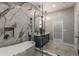 Luxurious bathroom with marble tile, double vanity, and large shower at 1102 Fountain Sw Dr, Atlanta, GA 30314
