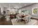 Open dining area with round wooden table and neutral decor at 1102 Fountain Sw Dr, Atlanta, GA 30314