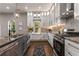 Updated kitchen with white cabinets, granite countertops, and stainless steel appliances at 1102 Fountain Sw Dr, Atlanta, GA 30314