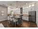 Modern kitchen with white cabinets, granite counters and island at 1102 Fountain Sw Dr, Atlanta, GA 30314