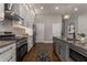 Modern kitchen with gray cabinets, granite counters, and stainless steel appliances at 1102 Fountain Sw Dr, Atlanta, GA 30314