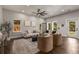 Bright living room with hardwood floors, comfy seating, and large windows at 1102 Fountain Sw Dr, Atlanta, GA 30314