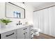 Modern bathroom with gray vanity, quartz countertop, and glass shower at 1457 Mcgarity Rd, Mcdonough, GA 30252