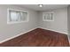 Bedroom featuring wood flooring and two windows at 1963 Shannon Ridge Ct, Decatur, GA 30032