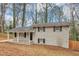 Exterior view of a two-story white brick house with black shutters and a covered front porch at 1963 Shannon Ridge Ct, Decatur, GA 30032