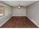 The spacious living room features a large window and a ceiling fan at 1963 Shannon Ridge Ct, Decatur, GA 30032