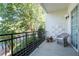 Private balcony with wicker chair and potted plants at 3101 Howell Mill Nw Rd # 206, Atlanta, GA 30327