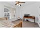 Bright bedroom with large window, ceiling fan, and workspace at 3101 Howell Mill Nw Rd # 206, Atlanta, GA 30327