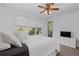 Bright bedroom with king-size bed, balcony access, and a TV at 3101 Howell Mill Nw Rd # 206, Atlanta, GA 30327