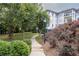 A paved pathway winds through a landscaped community area with lush greenery at 3101 Howell Mill Nw Rd # 206, Atlanta, GA 30327