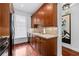 Modern kitchen with black appliances and wood cabinets at 3101 Howell Mill Nw Rd # 206, Atlanta, GA 30327
