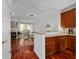 Open kitchen with wood cabinets and hardwood floors at 3101 Howell Mill Nw Rd # 206, Atlanta, GA 30327