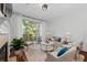 Spacious living room with hardwood floors, fireplace and balcony access at 3101 Howell Mill Nw Rd # 206, Atlanta, GA 30327