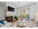 Living room features fireplace, hardwood floors, and balcony access at 3101 Howell Mill Nw Rd # 206, Atlanta, GA 30327
