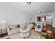 Living room with hardwood floors, comfy seating, and kitchen view at 3101 Howell Mill Nw Rd # 206, Atlanta, GA 30327