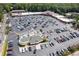 Aerial view of a large parking lot with stores and restaurants at 3101 Howell Mill Nw Rd # 206, Atlanta, GA 30327