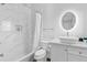 Clean bathroom with a bathtub, shower, and marble-tiled walls at 85 Boulevard Ne, Atlanta, GA 30312
