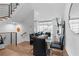 Elegant dining area with a glass table, black chairs, and hardwood floors at 85 Boulevard Ne, Atlanta, GA 30312