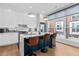 Modern kitchen with a blue island and stainless steel appliances at 85 Boulevard Ne, Atlanta, GA 30312