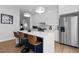 Modern kitchen with white cabinets, large island, and stainless steel appliances at 85 Boulevard Ne, Atlanta, GA 30312