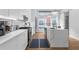 Modern kitchen with white cabinets, stainless steel appliances, and hardwood floors at 85 Boulevard Ne, Atlanta, GA 30312