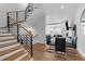 Modern staircase with sleek metal railing and light wood steps at 85 Boulevard Ne, Atlanta, GA 30312
