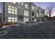 Exterior view of townhomes at dusk with parking area at 85 Boulevard Ne, Atlanta, GA 30312
