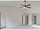 Spacious bedroom with ceiling fan and ample closet space at 11821 Rizvan Pl, Covington, GA 30014