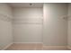 Large walk-in closet with wire shelving at 11821 Rizvan Pl, Covington, GA 30014
