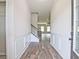 Bright entryway with wood-look floors and staircase at 11821 Rizvan Pl, Covington, GA 30014