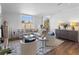 Spacious living room with hardwood floors, large windows, and city views at 130 26Th Nw St # 804, Atlanta, GA 30309