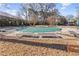 Community pool with green cover and lounge chairs at 130 26Th Nw St # 804, Atlanta, GA 30309
