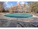 Community pool with green cover and lounge chairs at 130 26Th Nw St # 804, Atlanta, GA 30309