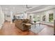Finished basement with L-shaped sectional sofa and hardwood floors at 2832 Springbluff Ln, Buford, GA 30519