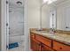 Bathroom boasts granite countertop, wood cabinet, and tub at 2832 Springbluff Ln, Buford, GA 30519