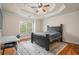 Spacious bedroom with hardwood floors and a ceiling fan at 2832 Springbluff Ln, Buford, GA 30519