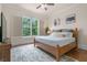 Bright bedroom with hardwood floors and a king-size bed at 2832 Springbluff Ln, Buford, GA 30519