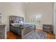 Comfortable bedroom with hardwood floors and a large window at 2832 Springbluff Ln, Buford, GA 30519