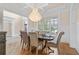 Formal dining room with hardwood floors, chandelier, and large windows at 2832 Springbluff Ln, Buford, GA 30519