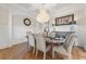 Elegant dining room with hardwood floors, a chandelier, and wainscoting at 2832 Springbluff Ln, Buford, GA 30519