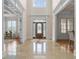Bright and spacious two story entryway with marble flooring and a grand staircase at 2832 Springbluff Ln, Buford, GA 30519