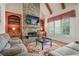 Spacious Gathering room featuring a stone fireplace, built-in shelving, and large windows at 2832 Springbluff Ln, Buford, GA 30519