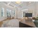 Spacious home office with built-in shelving, hardwood floors, and a large window at 2832 Springbluff Ln, Buford, GA 30519