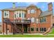Brick house exterior with large deck and landscaped yard at 2832 Springbluff Ln, Buford, GA 30519