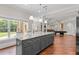 Open kitchen with large island, granite countertops and views to backyard at 2832 Springbluff Ln, Buford, GA 30519