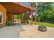Large patio with fire pit and stairs leading to deck above at 2832 Springbluff Ln, Buford, GA 30519